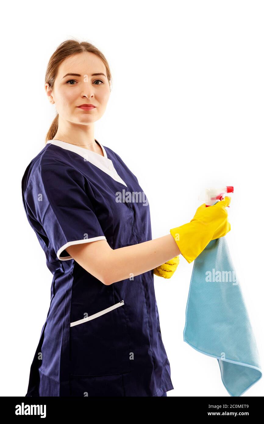 Young woman in apron isolated on white background. Cleaning concept ...