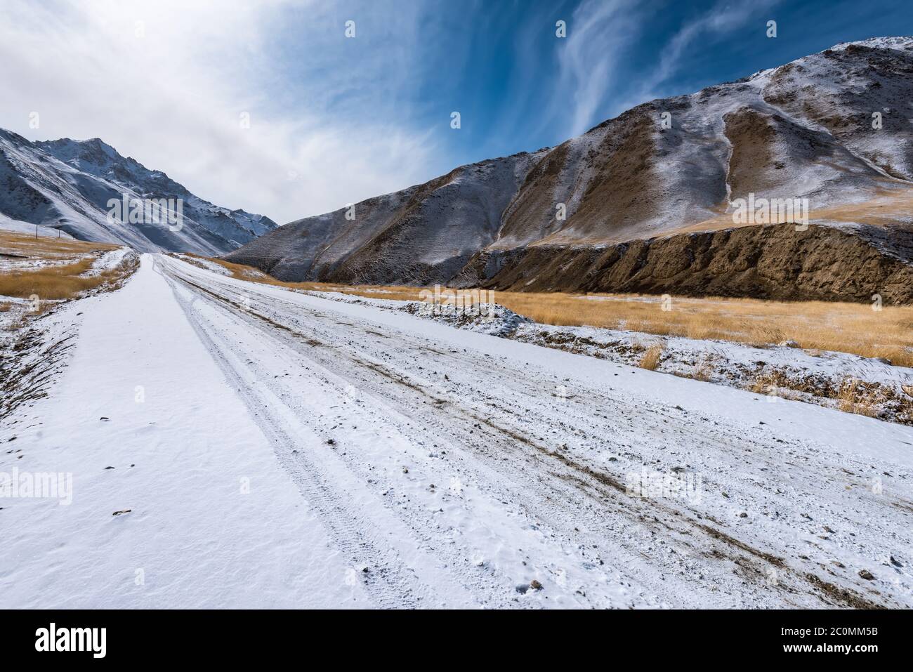the gravel road on the snow mountain Stock Photo
