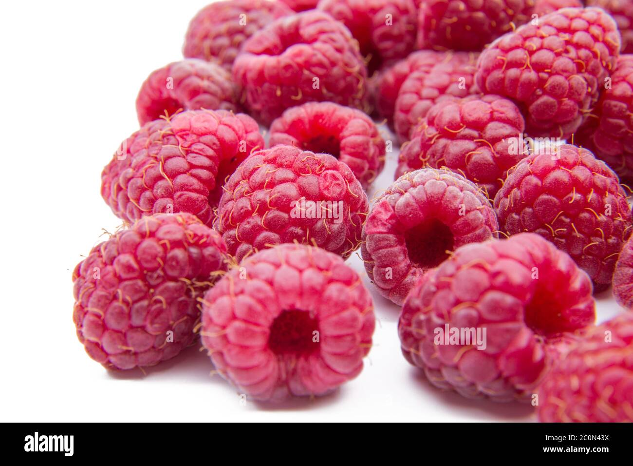 Raspberries isolated on white background Stock Photo - Alamy