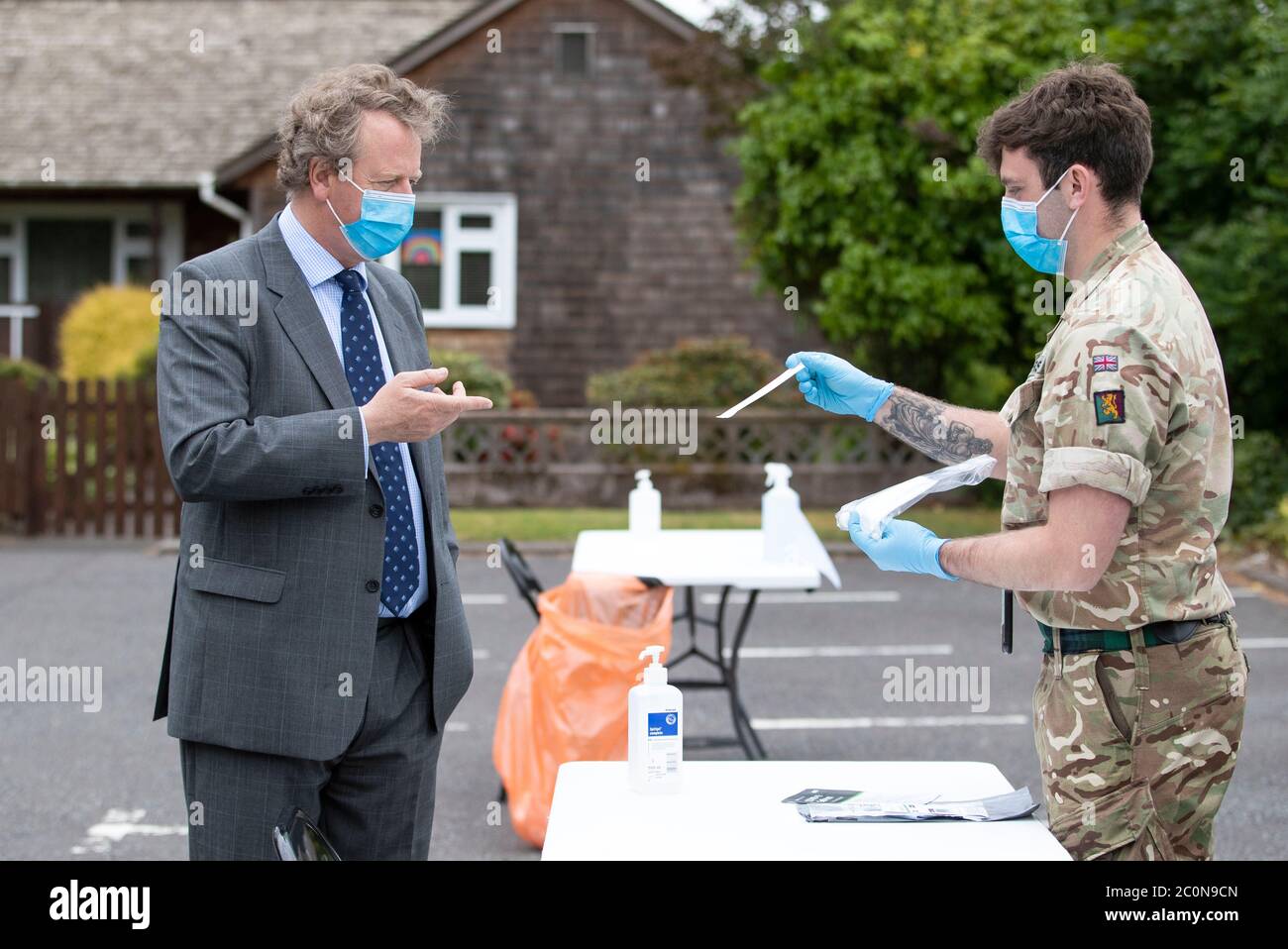 Scottish Secretary Alister Jack meets members of the 5th Battalion Royal Regiment of Scotland Balaclava Company during a visit to a mobile coronavirus testing unit being run by the army in Moffat, Scottish Borders. Stock Photo