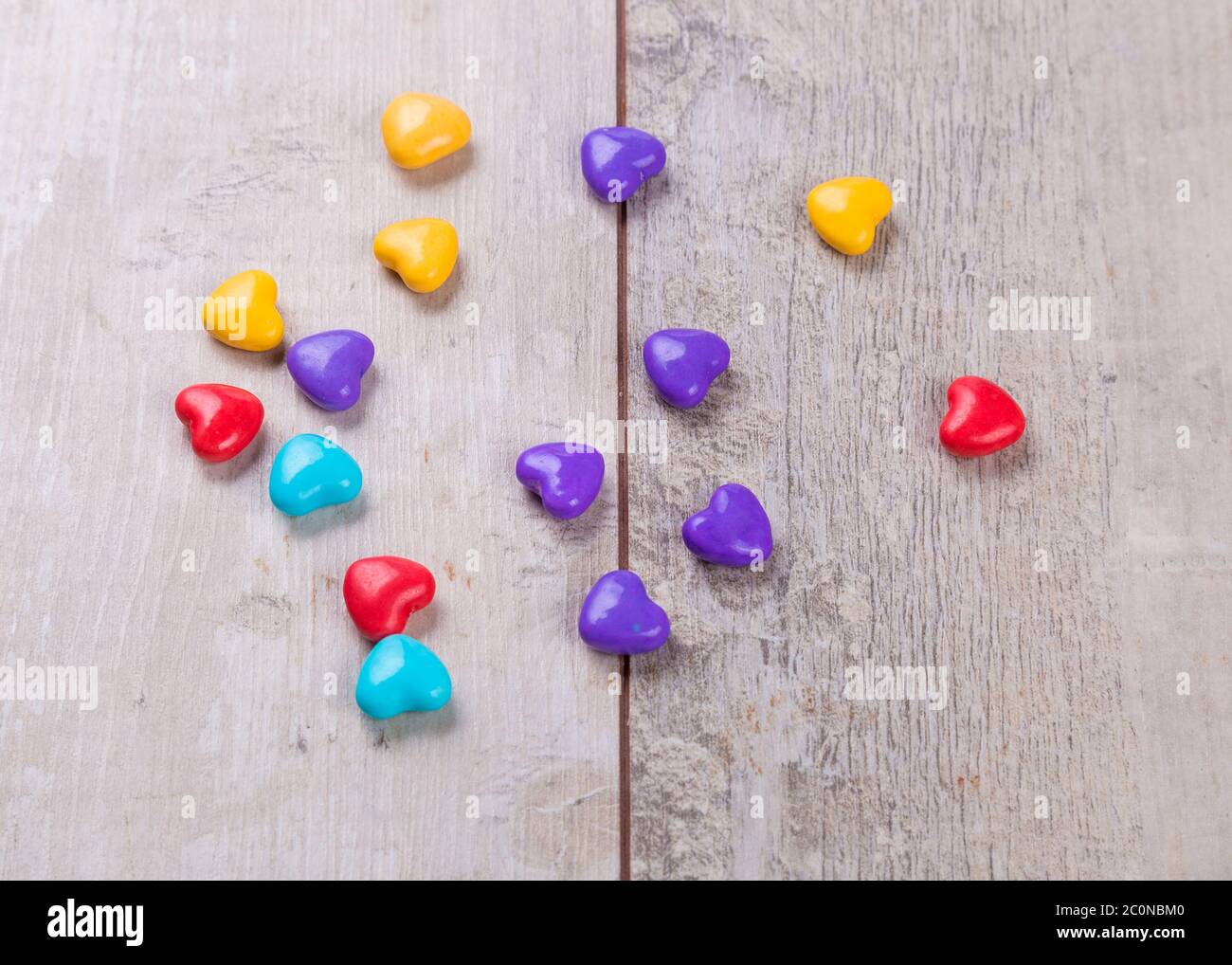 Heart shaped candy on wooden background Stock Photo