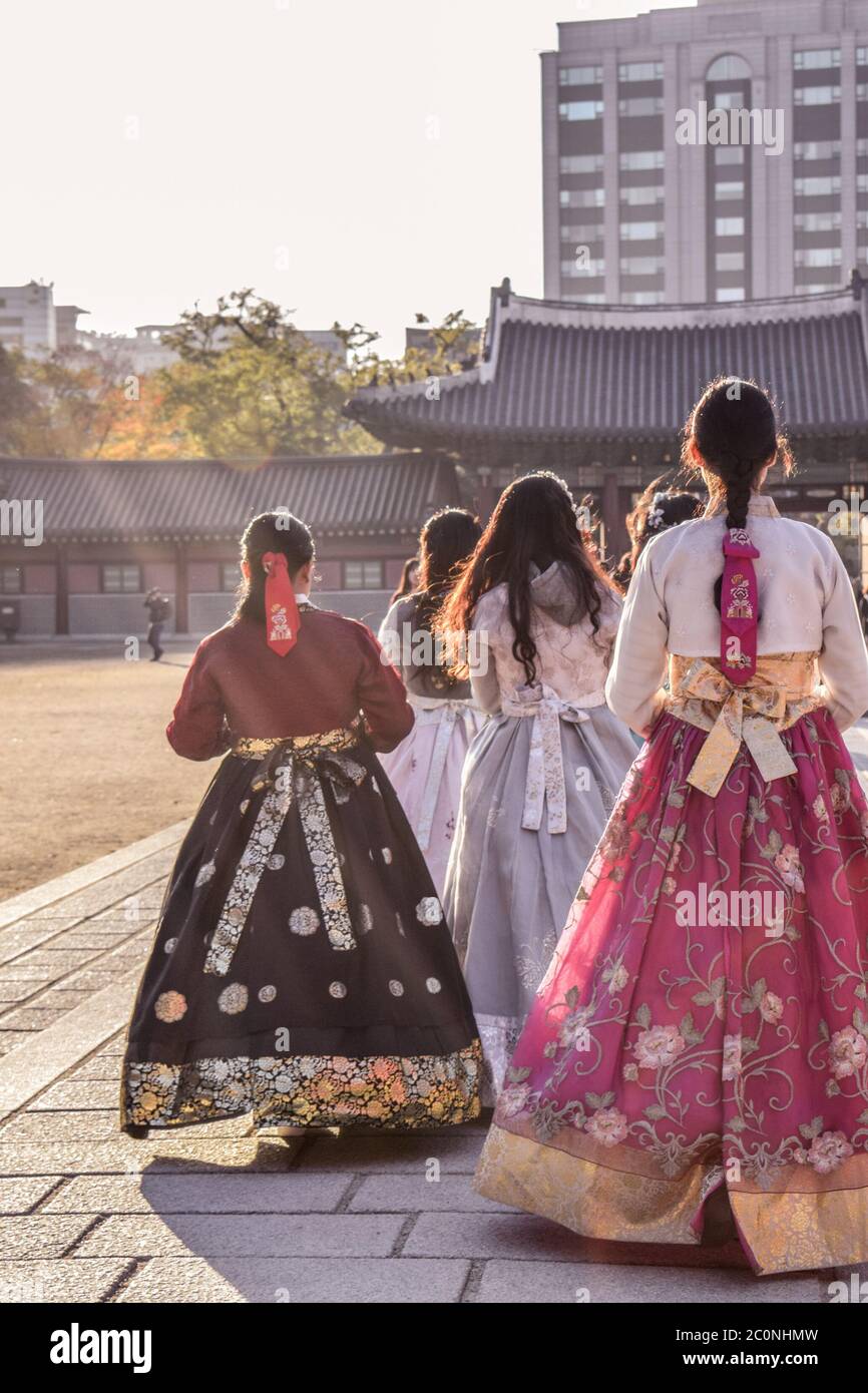 Korean girls in colurful national traditional costumes hanbok walking in a gyeongbokgung palace in Seoul South Korea Stock Photo