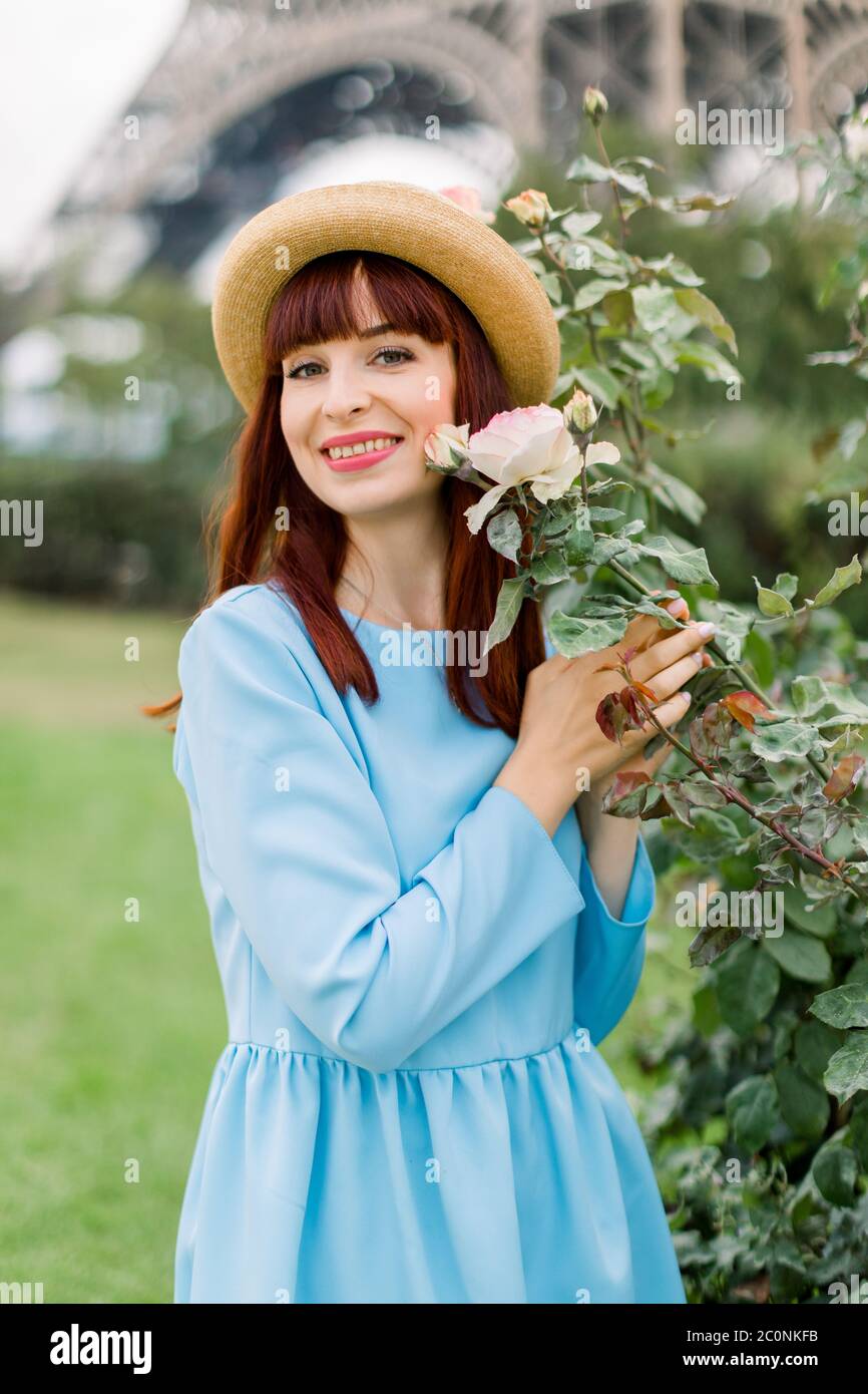 Close up portrait of charming smiling young red haired woman, wearing ...