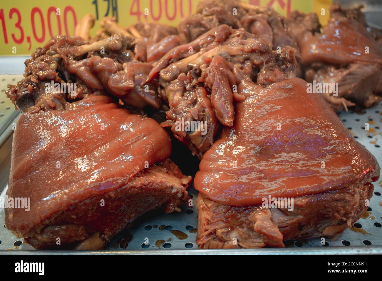 Roasted pork knuckles sold on a street food market in Seoul South Korea Stock Photo