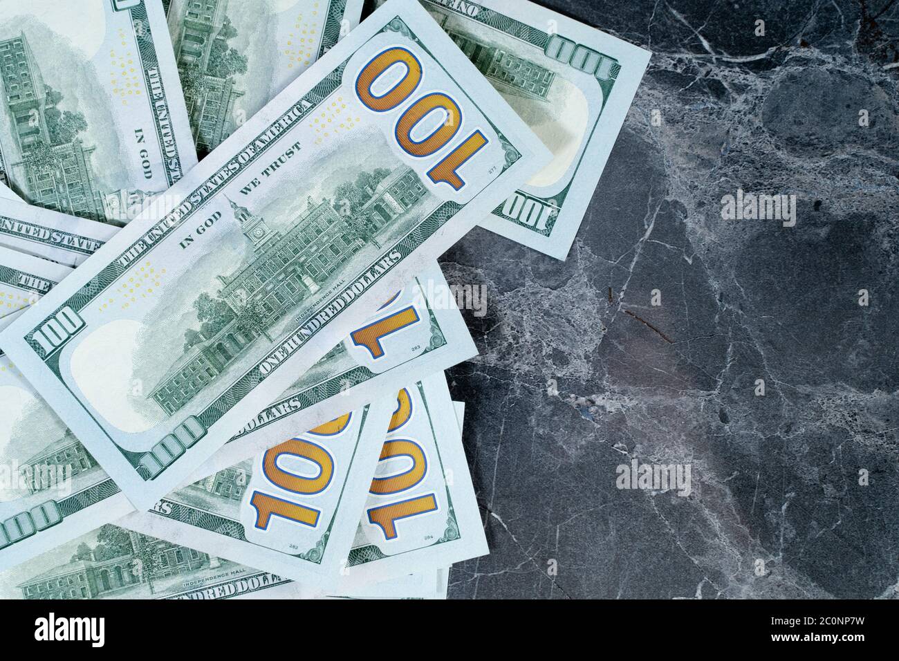dollars lying on a gray marble table Stock Photo