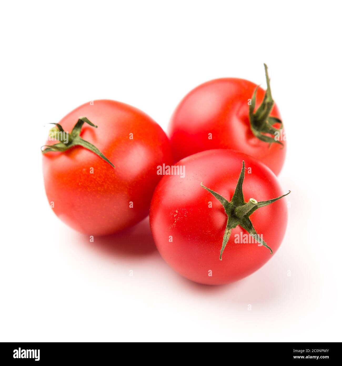 Three tomatoes isolated on white background Stock Photo