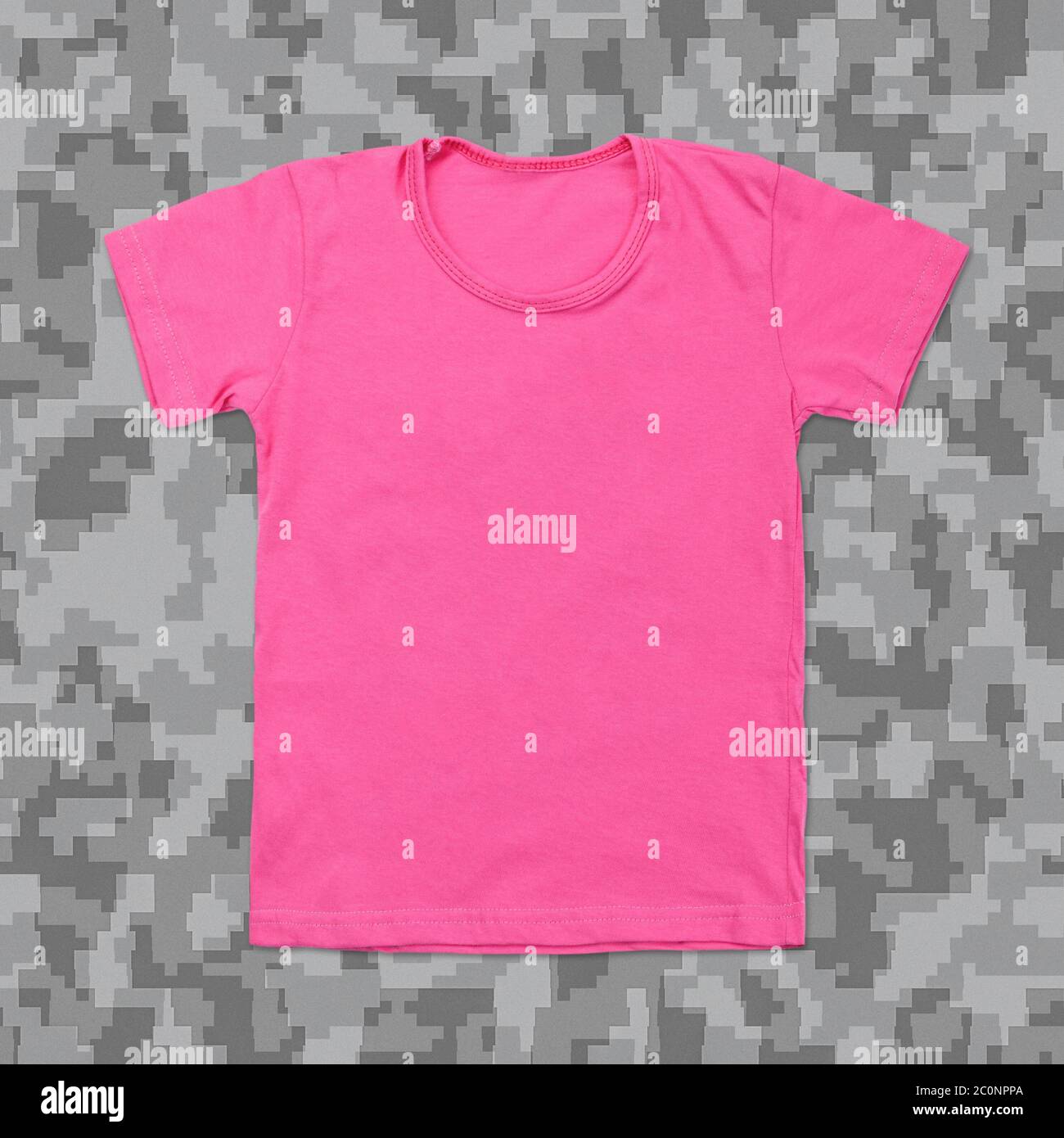 Pink blank t-shirt on camouflage background Stock Photo