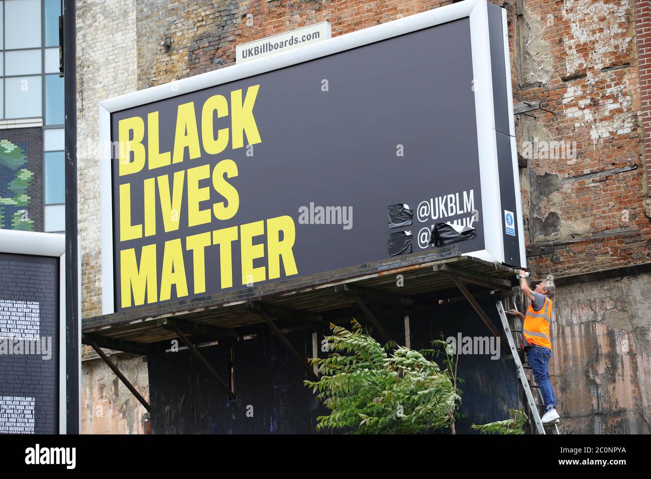 A Black Lives Matter billboard is unveiled on Westminster Bridge Road, London. Stock Photo