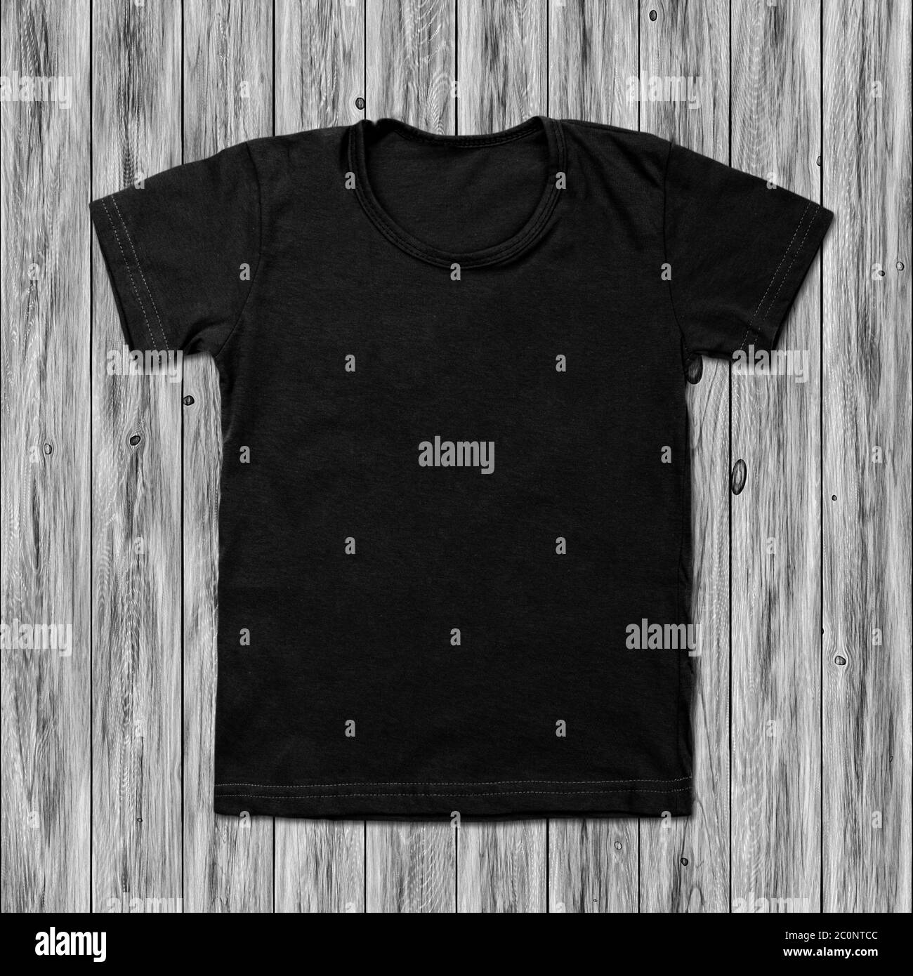 Black blank t-shirt on wood background Stock Photo
