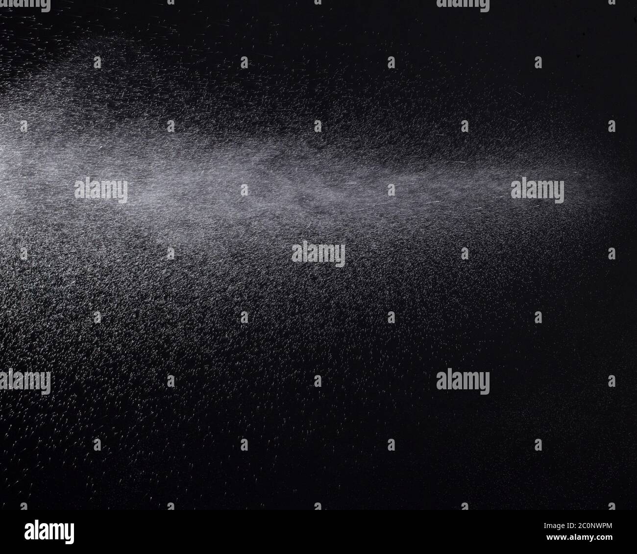 a spray of liquid in a black background Stock Photo Alamy