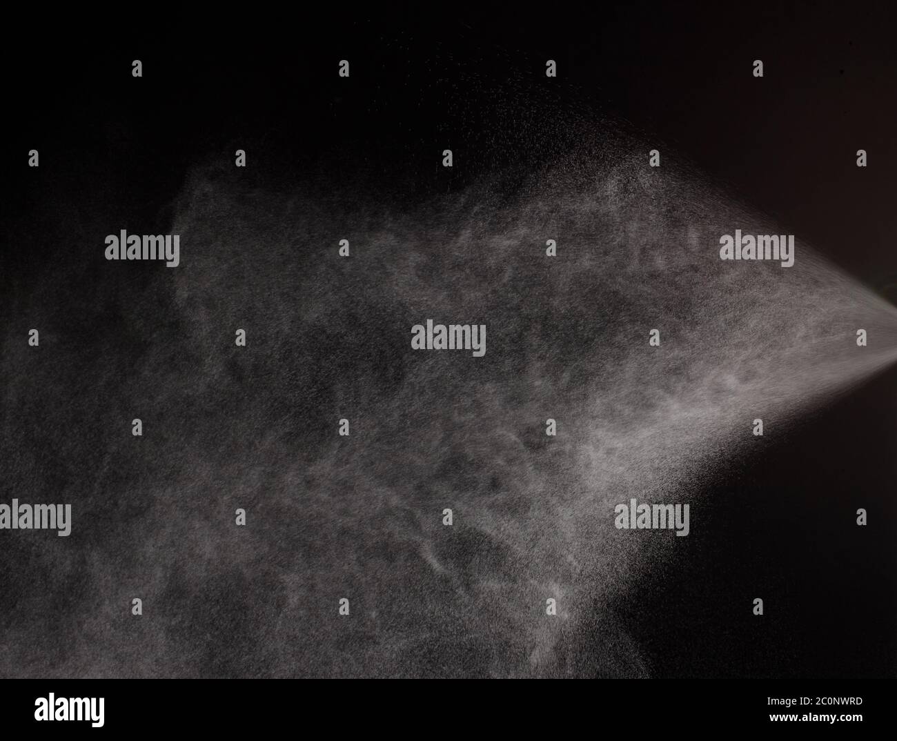 a spray of liquid in a black background Stock Photo Alamy