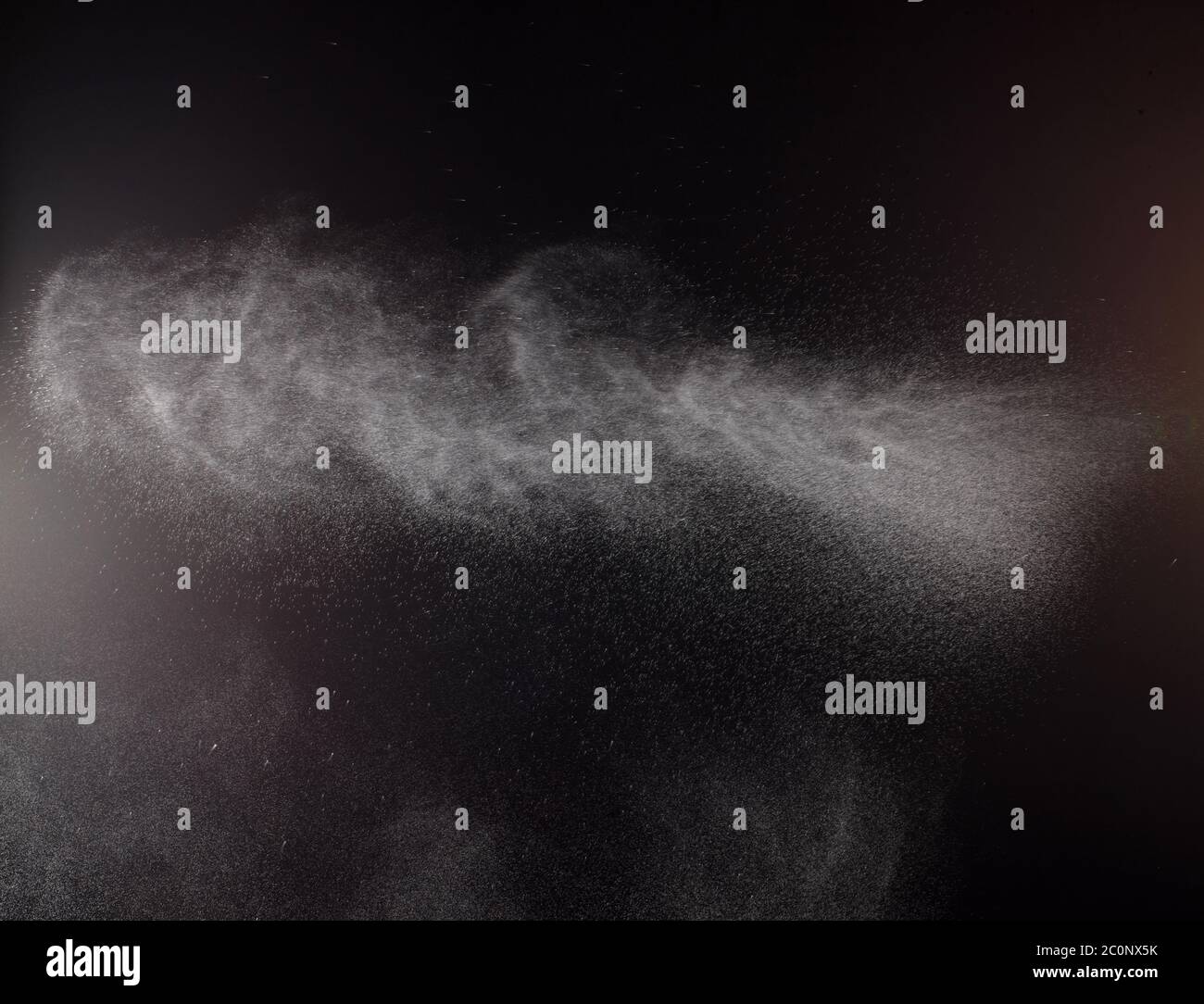 a spray of liquid in a black background Stock Photo Alamy