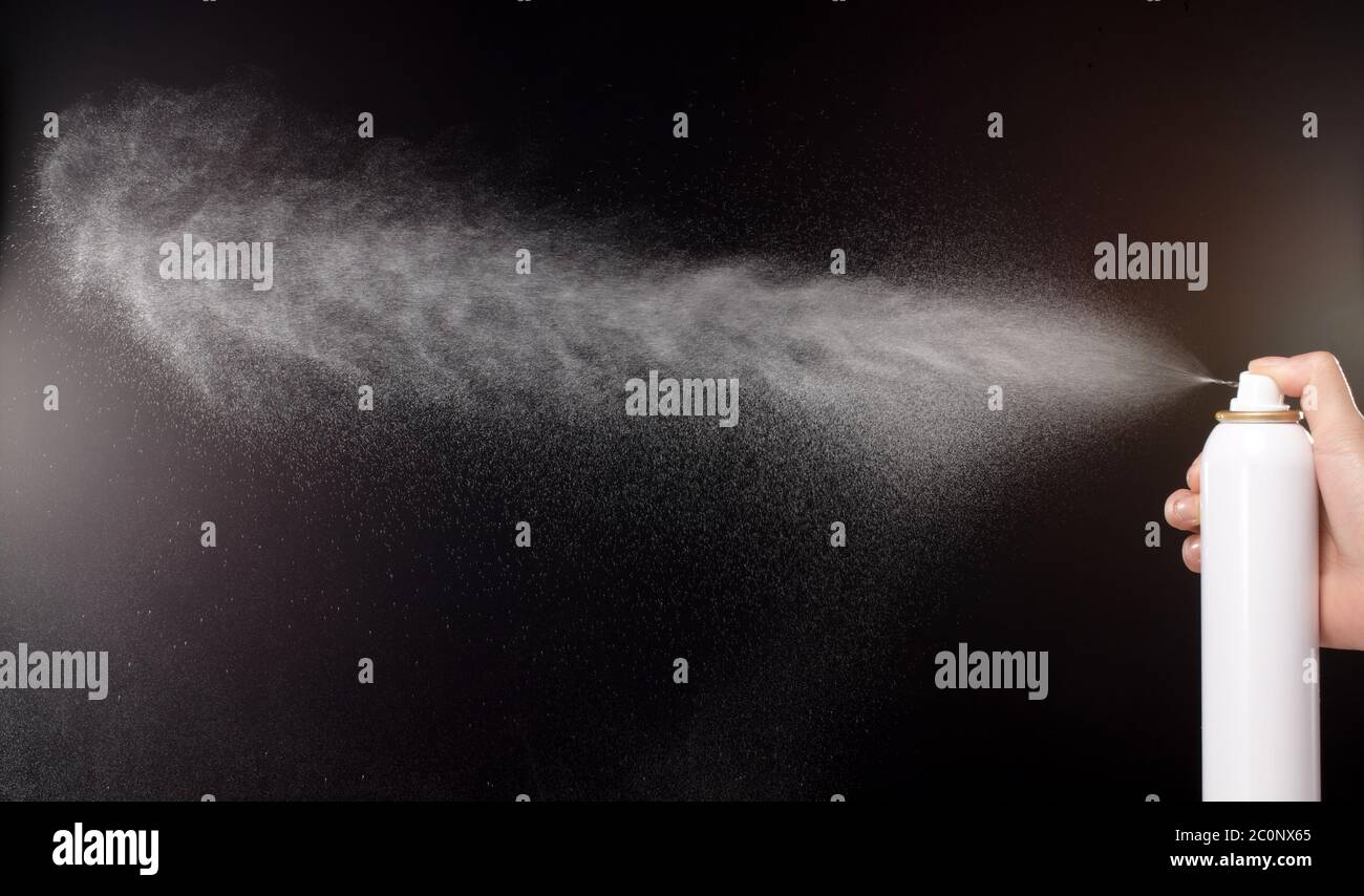 a spray of liquid in a black background Stock Photo Alamy