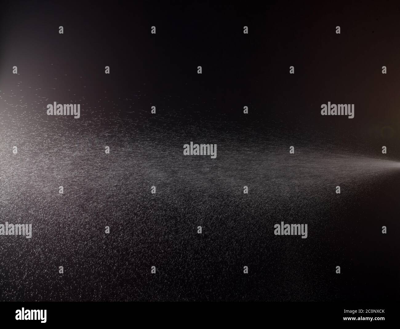 a spray of liquid in a black background Stock Photo Alamy