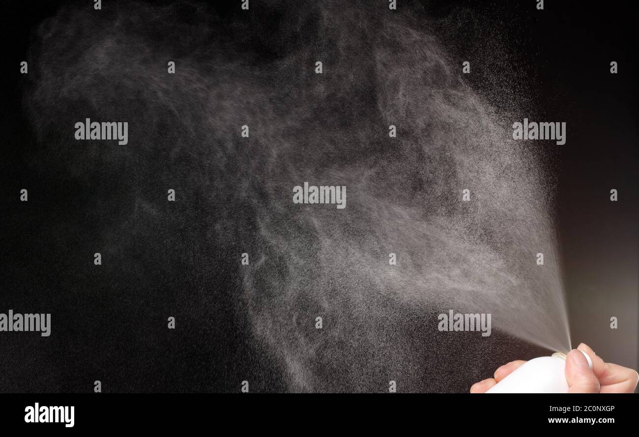 a spray of liquid in a black background Stock Photo Alamy