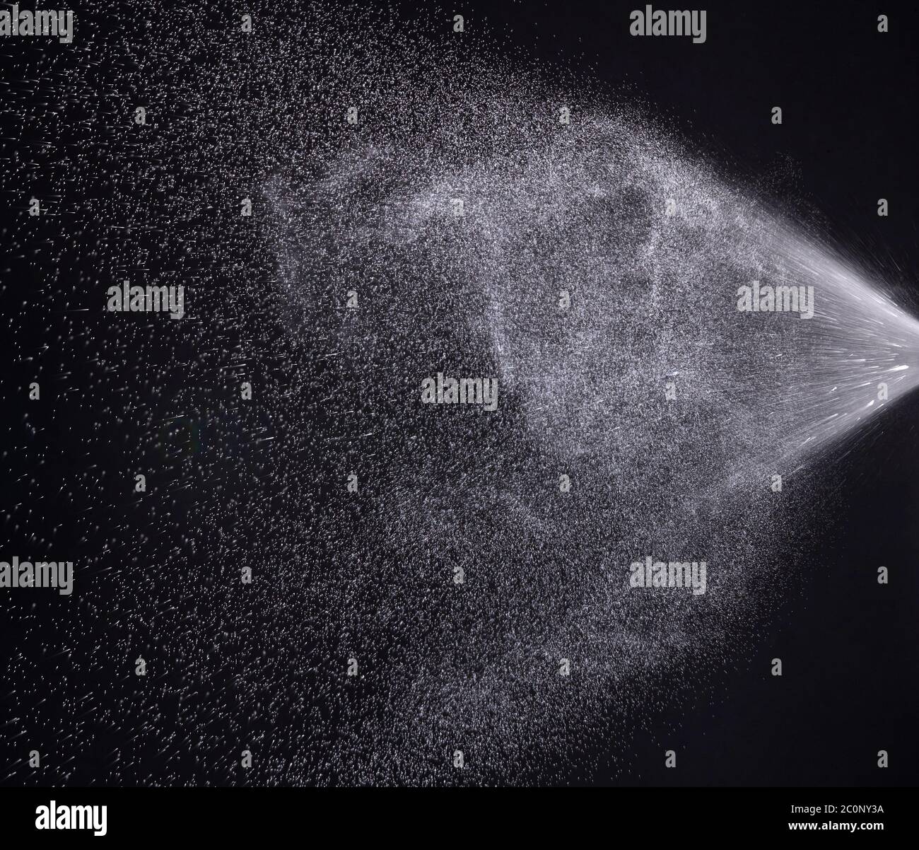 a spray of liquid in a black background Stock Photo Alamy
