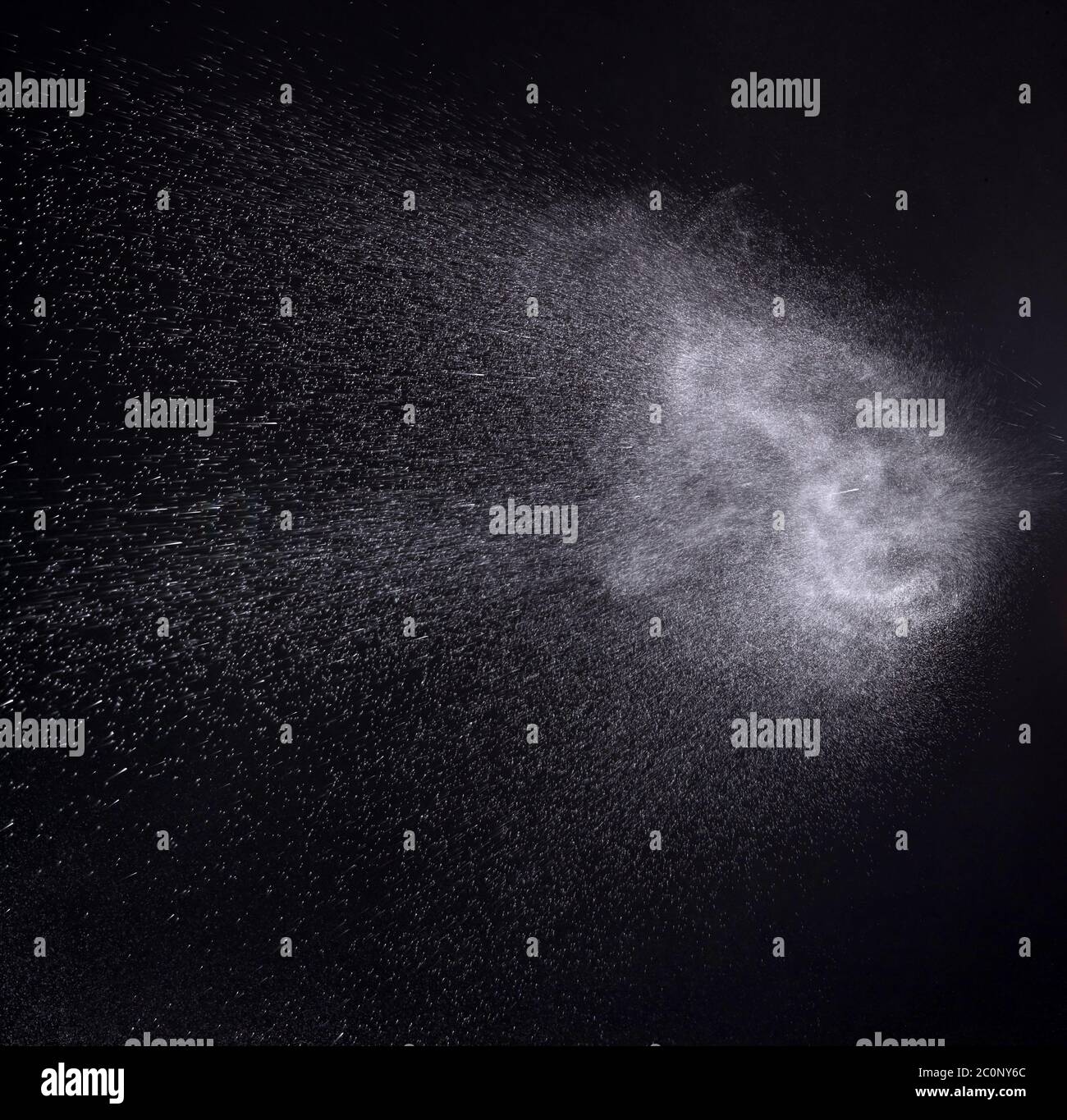 a spray of liquid in a black background Stock Photo Alamy