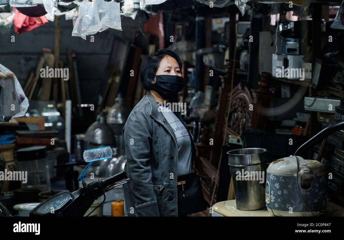 Depok, Indonesia. 11th June, 2020. A consumer wears a face mask as a preventative measure, at a flea market in Depok, West Java, Indonesia, June 11, 2020. (Photo by Evan Praditya/INA Photo Agency/Sipa USA) Credit: Sipa USA/Alamy Live News Stock Photo