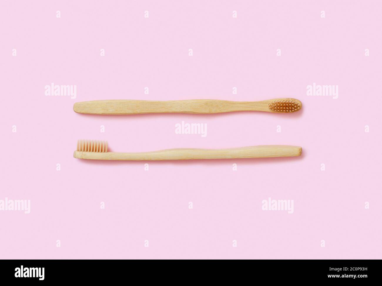 Top view of organic zero waste bamboo toothbrushes on pink background Stock Photo