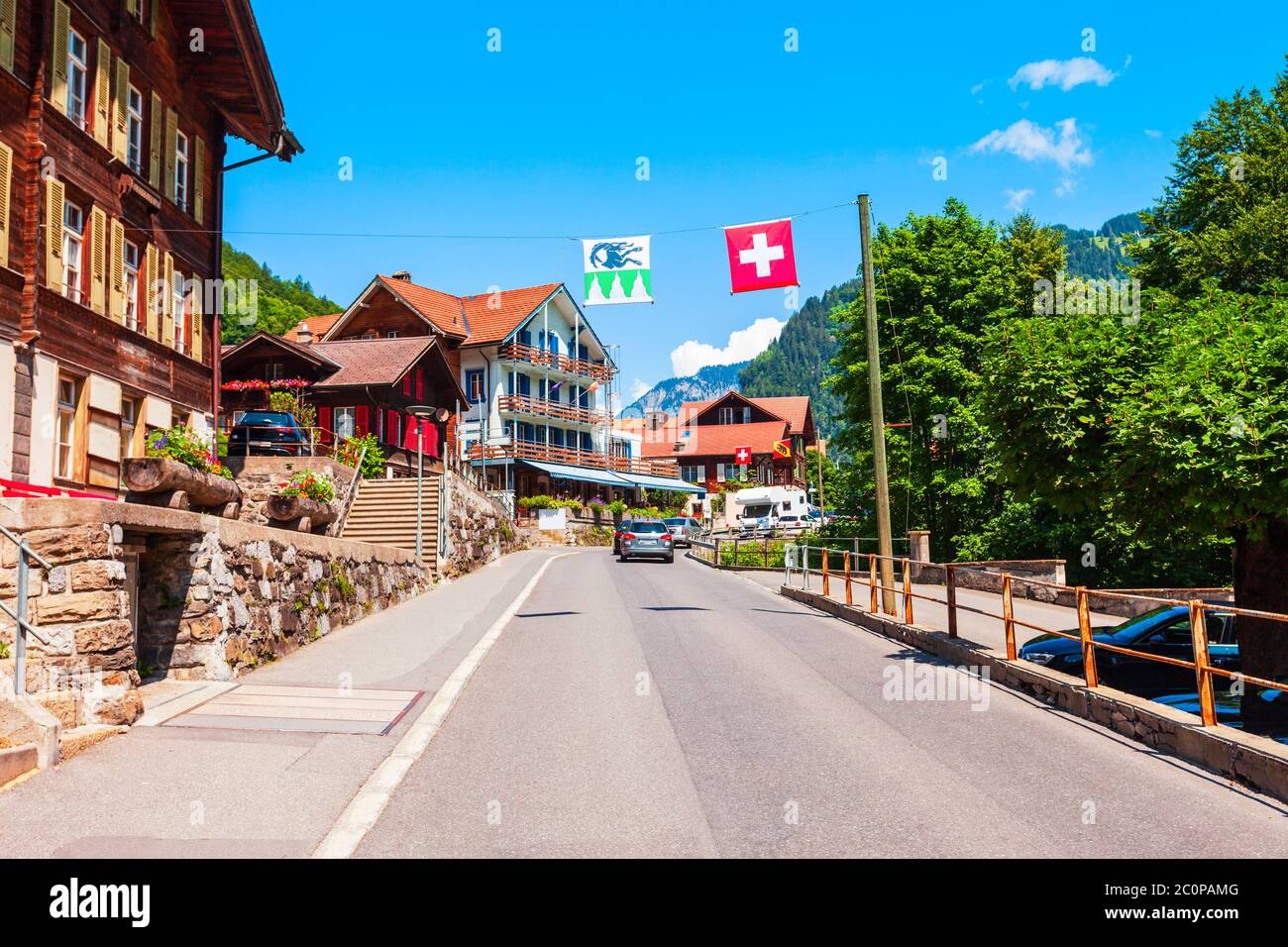 Traditional local houses in Lauterbrunnen village in the Interlaken district in the Bern canton of Switzerland Stock Photo