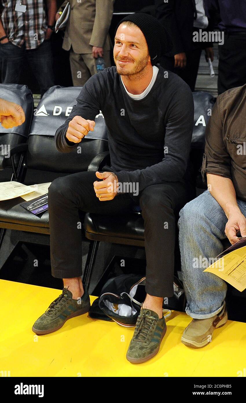 David Beckham watches the LA Lakers v Indiana Pacers in the NBA, Staples  Center, Los Angeles, California with LA Galaxy equipment man Raul Vargas.  27 November 2012 Stock Photo - Alamy