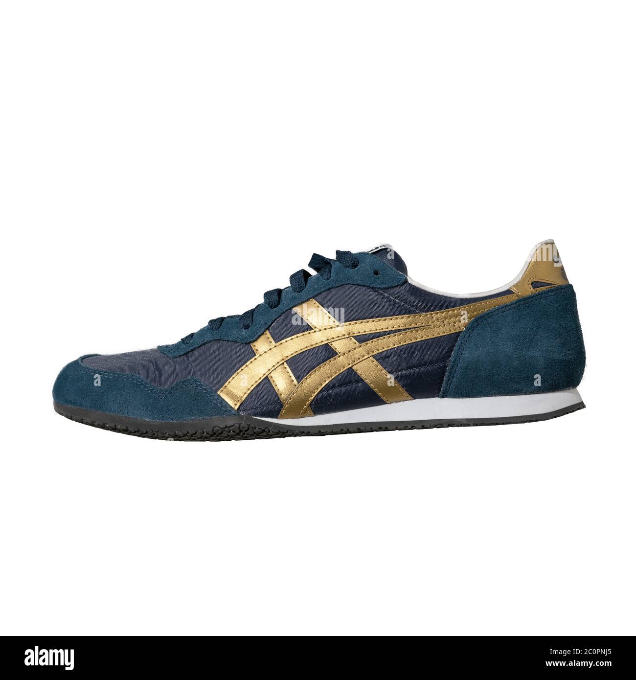 Blue Asics brand sneakers with gold accents. Onitsuka Tiger brand.  Convenient easy lace-up shoes for sport isolated on color background.  Lifestyle Stock Photo - Alamy