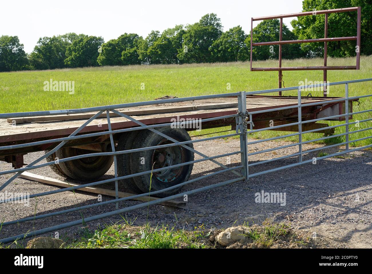 A lorry trailer parked to obstruct a field gate and stop trespassers. Stock Photo