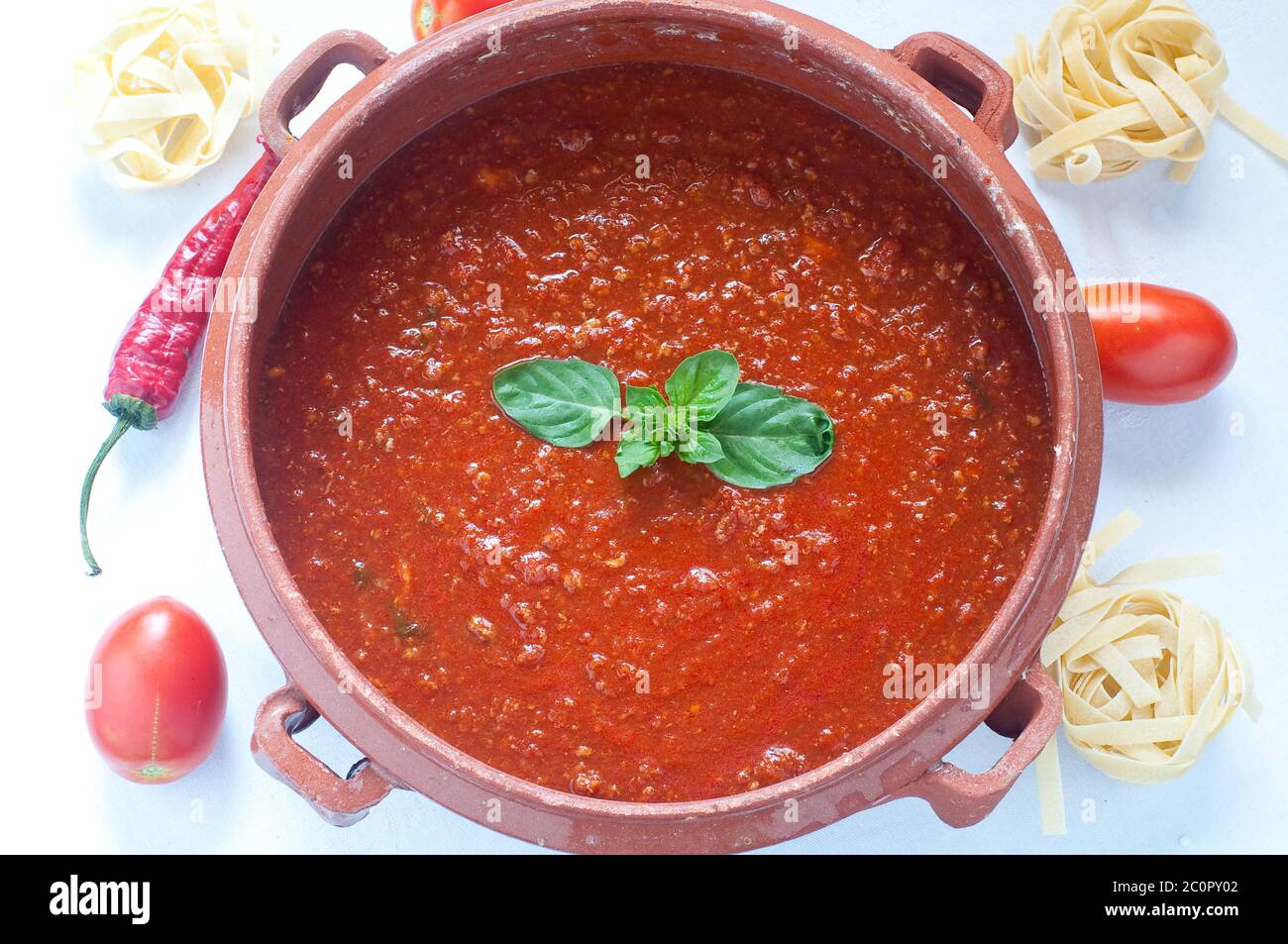 Tomato sauce in a clay pot Stock Photo Alamy