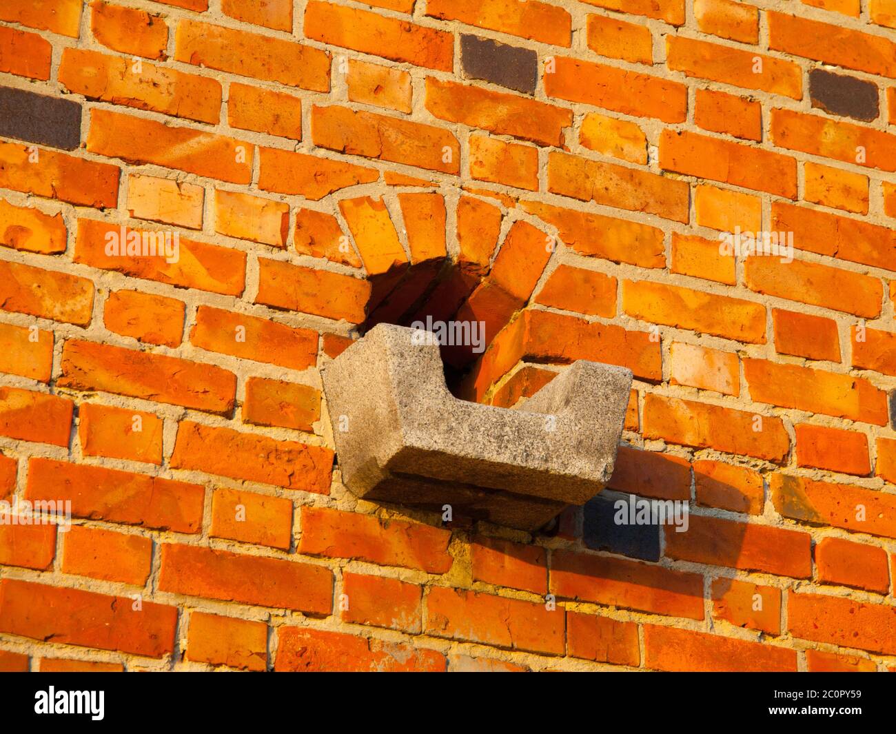 Historical gutter in the brick wall, Malbork castle, Poland Stock Photo