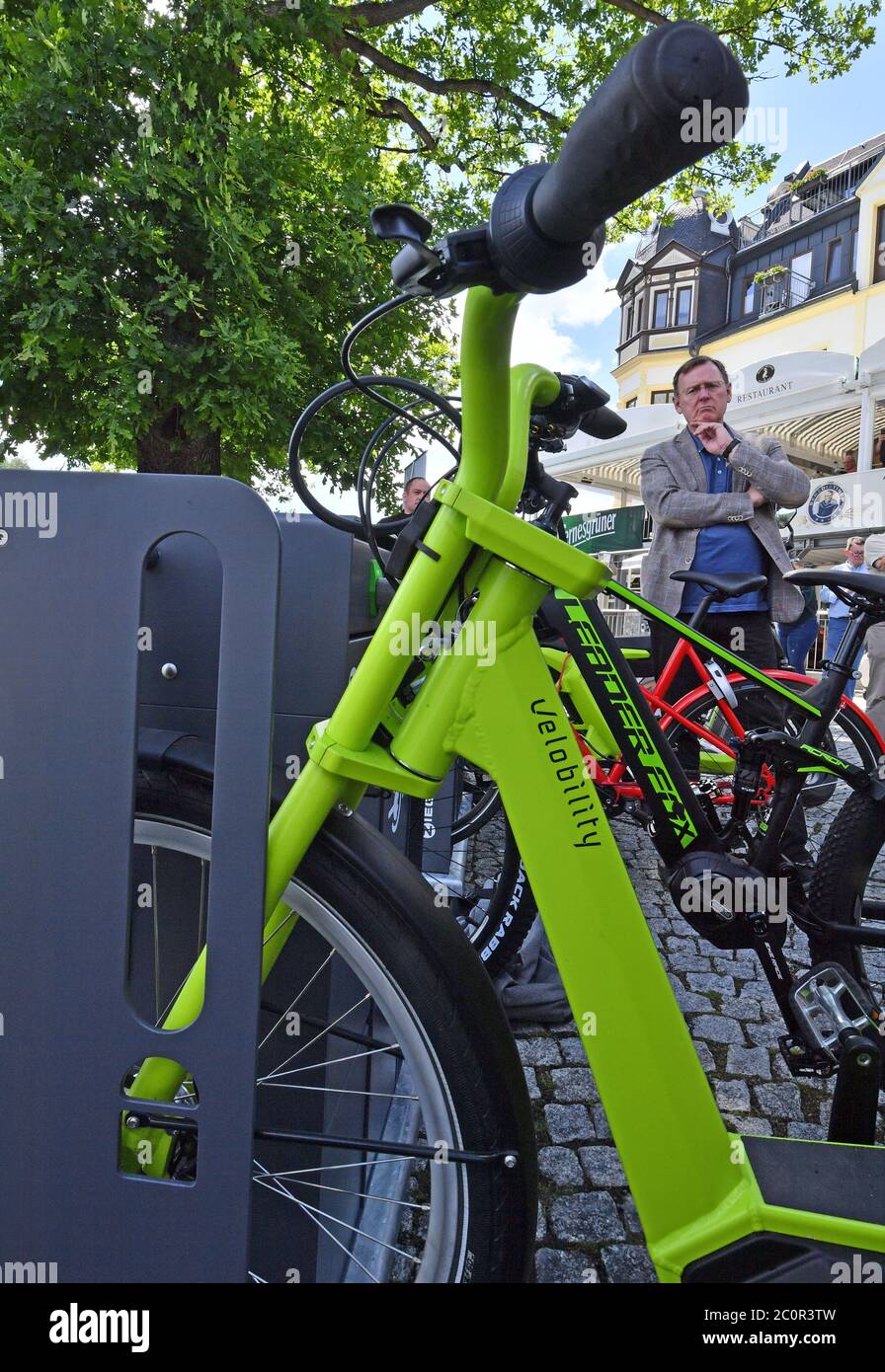 12 June 2020, Thuringia, Saalburg-Ebersdorf: Bodo Ramelow (Die Linke), Minister President of Thuringia, looks at a new e-bike charging station that was put into operation on the same day at the passenger ship Saalburg. Further stations are to follow in order to boost cycle tourism in the reservoir region known as the 'Thuringian Sea' at the Bleiloch Dam and the Hohenwarte Reservoir. Photo: Martin Schutt/dpa-Zentralbild/dpa Stock Photo
