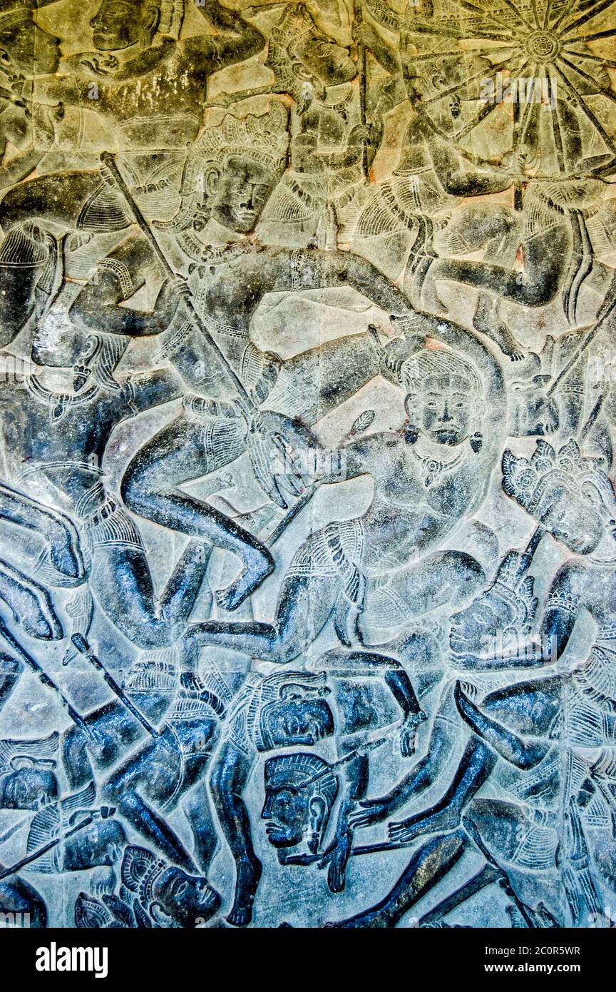 Ancient bas relief carving showing the Hindu god Kama on the side of the Kauravas at the Battle of Kurukshetra. Eleventh century carving, Angkor Wat T Stock Photo