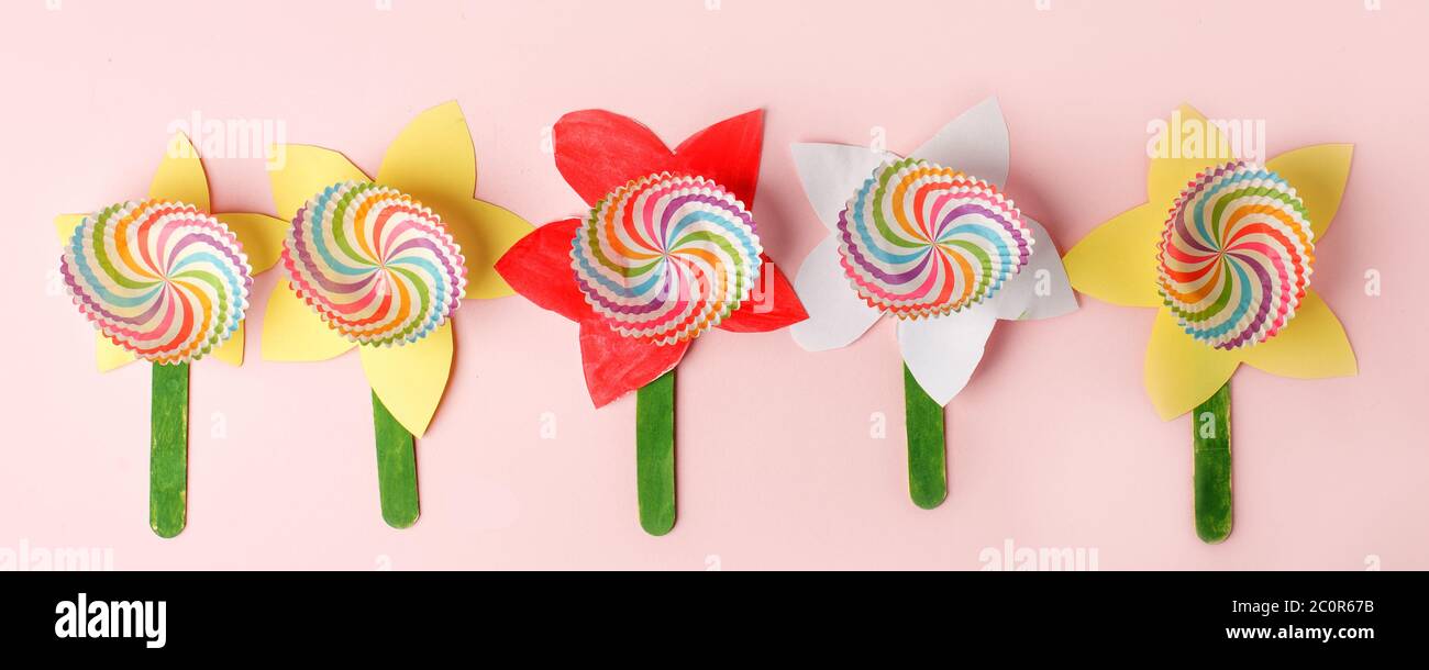 Paper craft Flower Decoration Concept on pink background, simple creative diy idea for kids, daycare, kindergarten, school, Happy mother day greeting Stock Photo