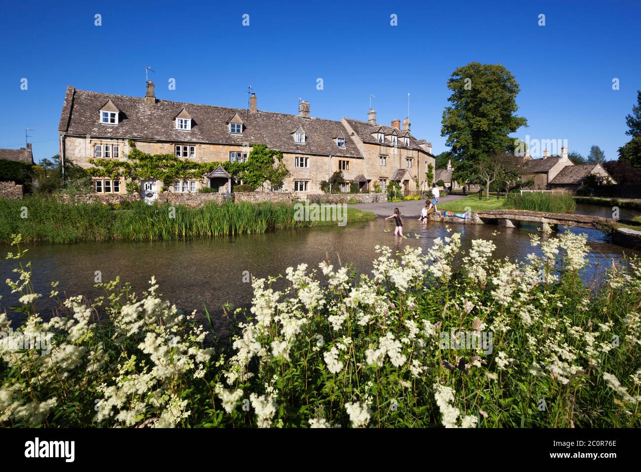 Cotswold cottages on the River Eye, Lower Slaughter, Cotswolds, Gloucestershire, England, United Kingdom Stock Photo