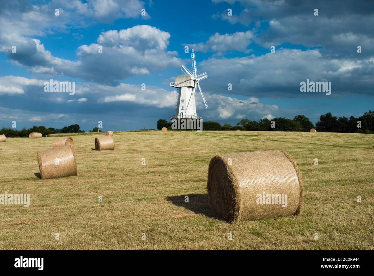 Windmill and round hay bales, Sandhurst, Kent, England, United Kingdom, Europe Stock Photo