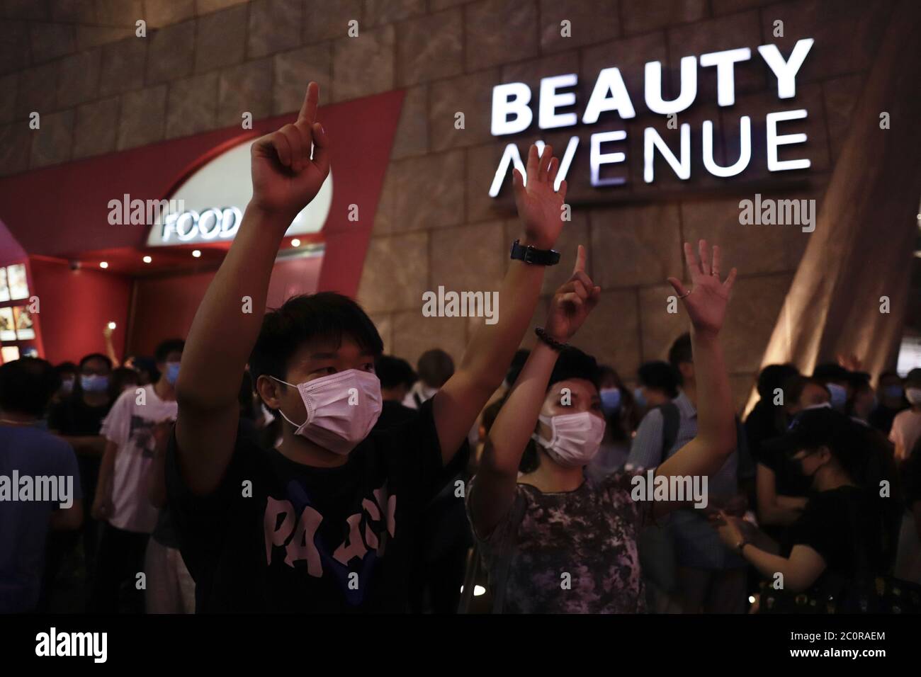 Hong Kong China 12th June A Couple Displaying Five Demands Hand Signs As A Gesture Of Protest On The Evening Of First Anniversary Of Anti Extradition Law Protest In Mong Kok Where