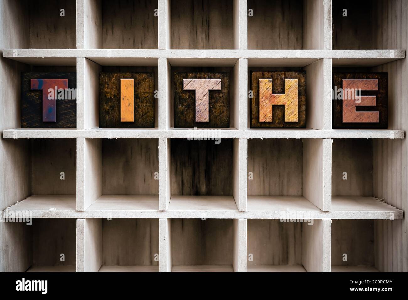 Tithe Concept Wooden Letterpress Type in Drawer Stock Photo
