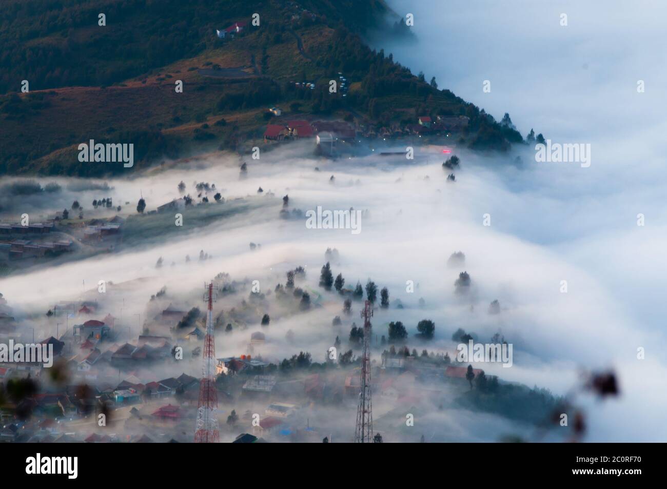 Layer of Mist Over the Mountains and in a village Stock Photo - Alamy