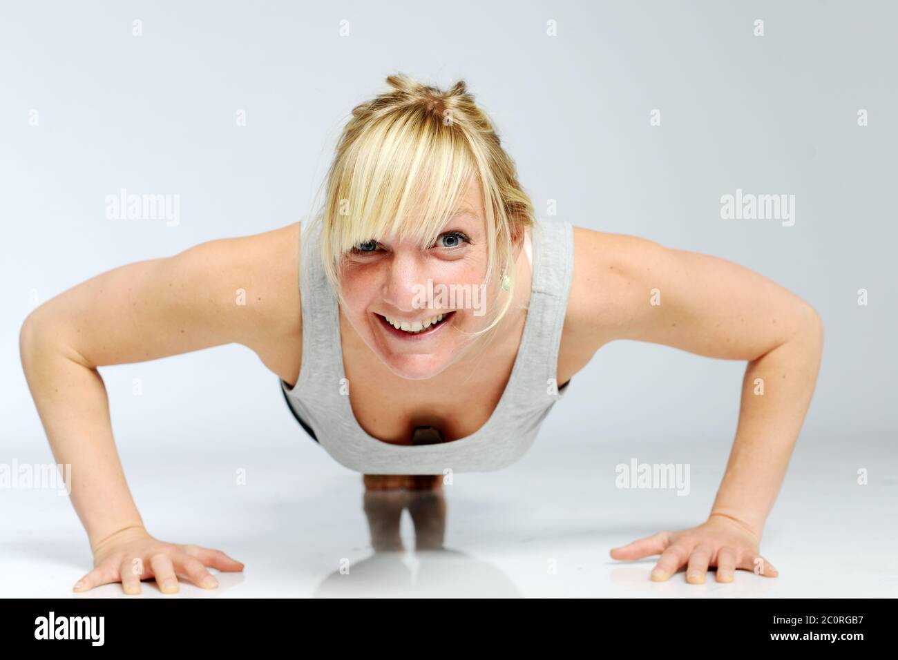Blond woman is practicing yoga Stock Photo