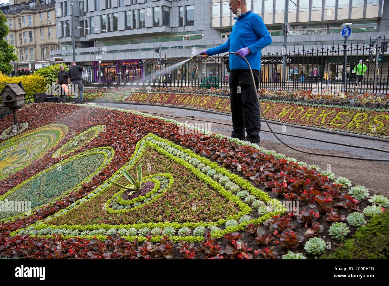 West Princes Street Gardens, Edinburgh Scotland, UK. 12 June 2020. Edinburgh's Floral Clock the world’s oldest – has the message Edinburgh thanks all key workers. Work was completed on 35,000 plus plants at 4pm by the three modest Gardeners, Tam, Davie and Alan who spent 6 weeks on the 2020 version of the popular landmark in the city. Before April, the design was to be a special commemoration of the 350th anniversary of the (RBGE). A change of plans means the Floral Clock – first created in 1903 – is now a colourful tribute to the NHS and other key workers. Stock Photo