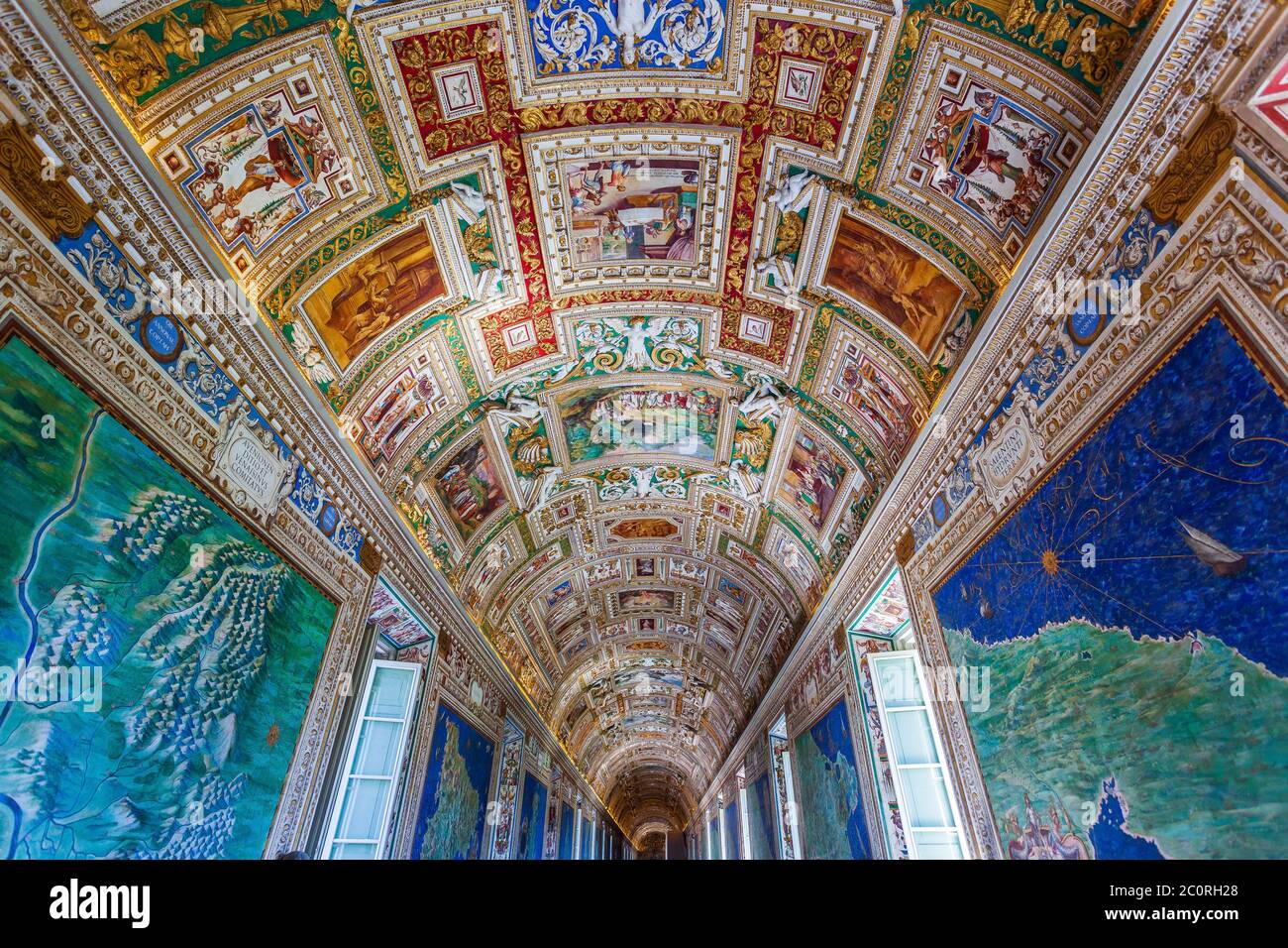 Rome, Italy - November 3, 2019: Paintings on the walls and the ceiling in the Gallery of Maps, at the Vatican Museum. Stock Photo