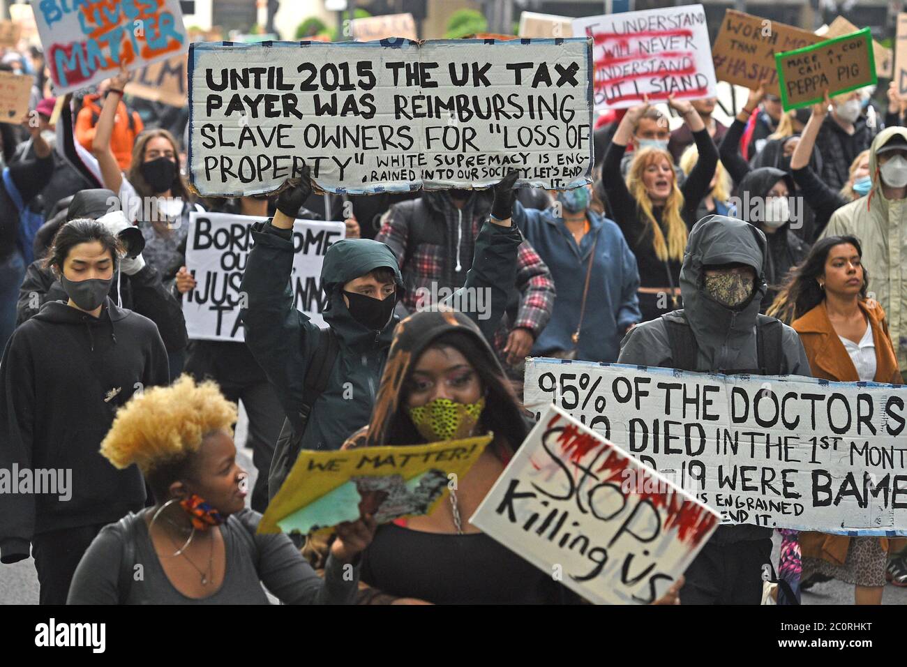 People walk past Buckingham Palace during a Black Lives Matter protest march in London. Stock Photo