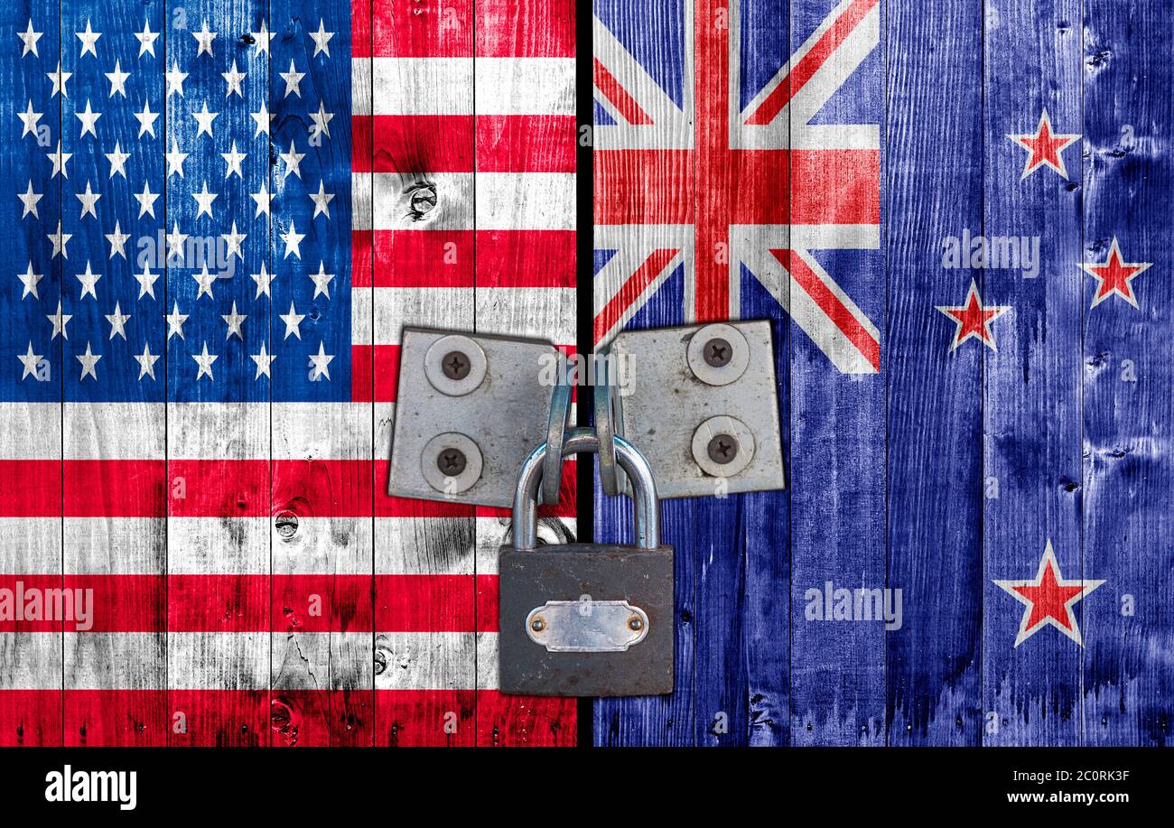 US and  New Zeland flag on door with padlock Stock Photo