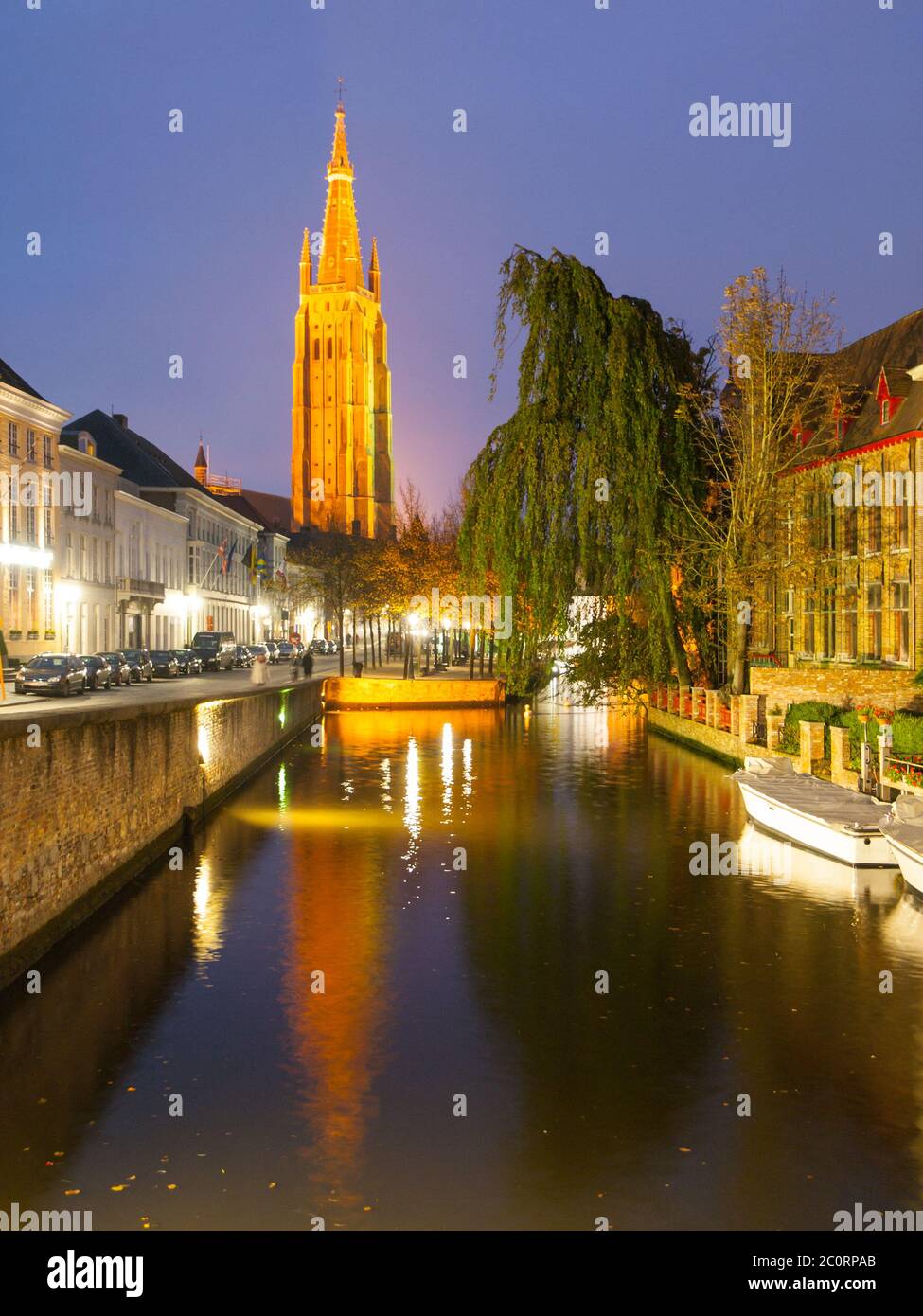 Church of Our Lady and water canal by night, Bruges, Belgium. Stock Photo