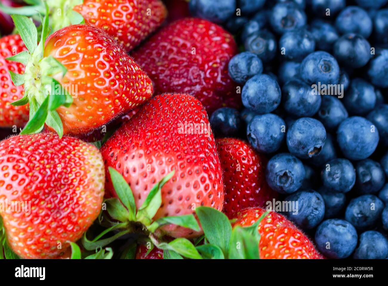 A close up view of strawberries and blueberries. Stock Photo