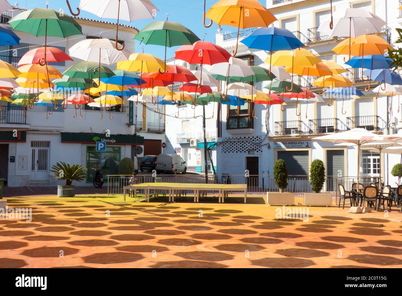Andalucia in Spain: an art installation comprising colourful umbrellas in  the Plaza de la Constitución, Torrox Pueblo Stock Photo - Alamy