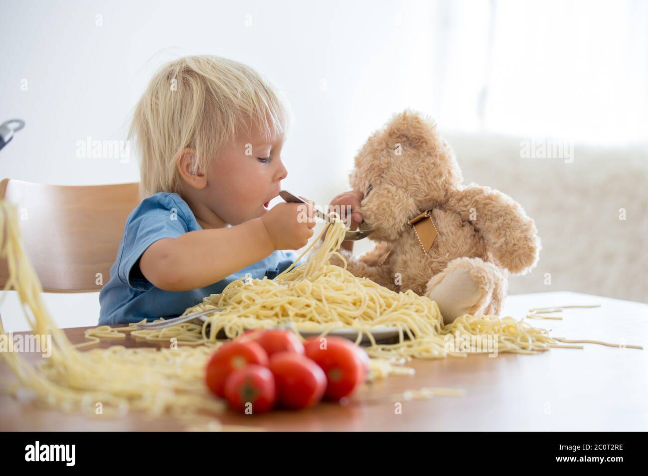 feeding baby spaghetti