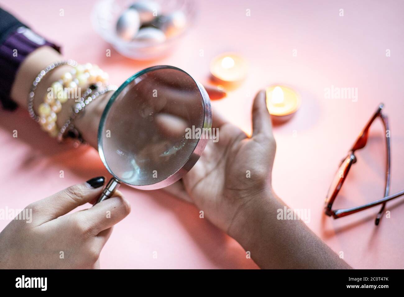 palmistry fortune teller reads lines on hand or palm to tell future