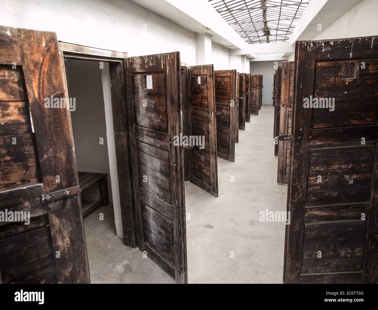 Long corridor with many doors to prison cells. Vintage image. Stock Photo