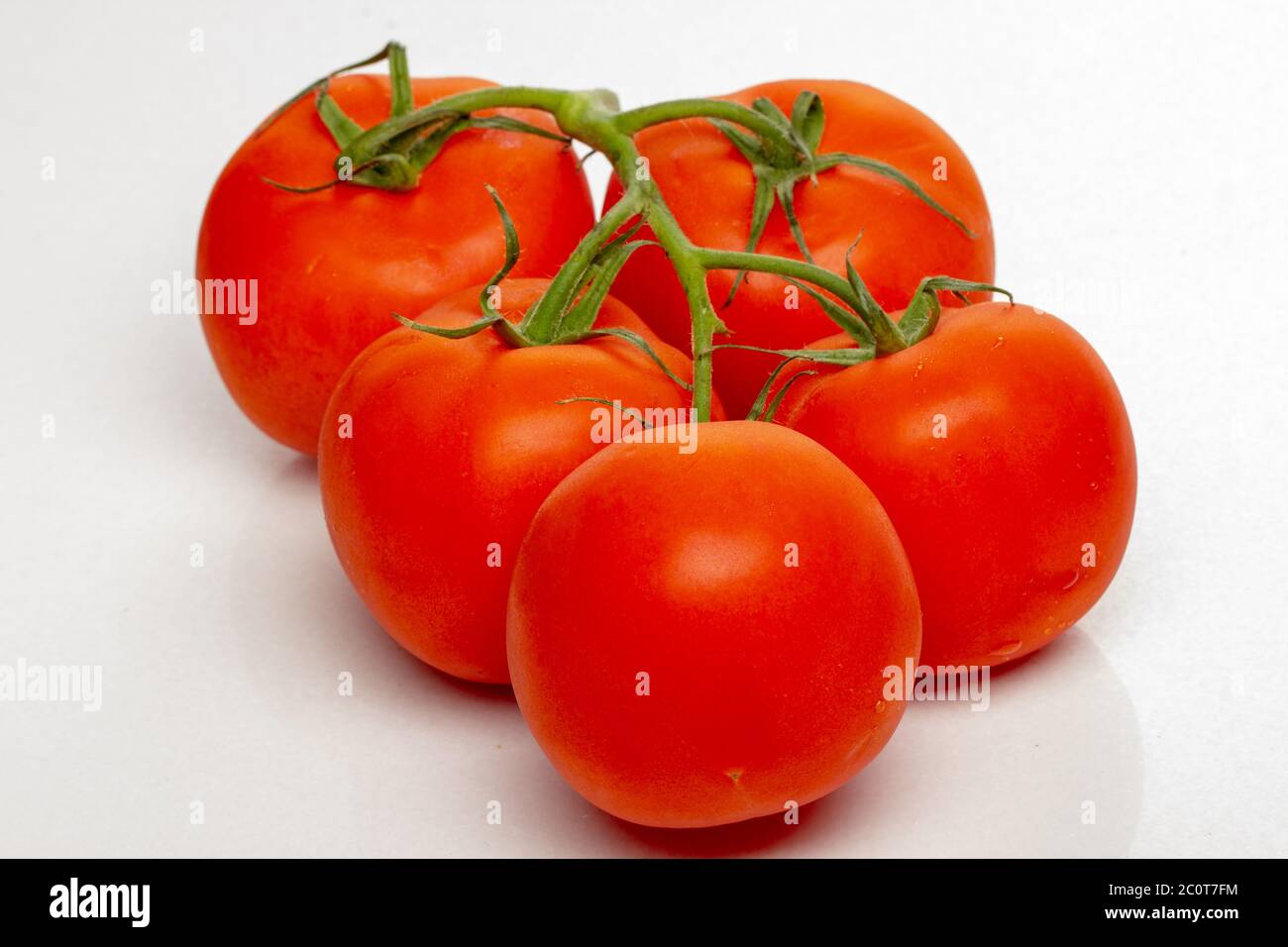 branch of cherry tomatoes on a white background Stock Photo - Alamy