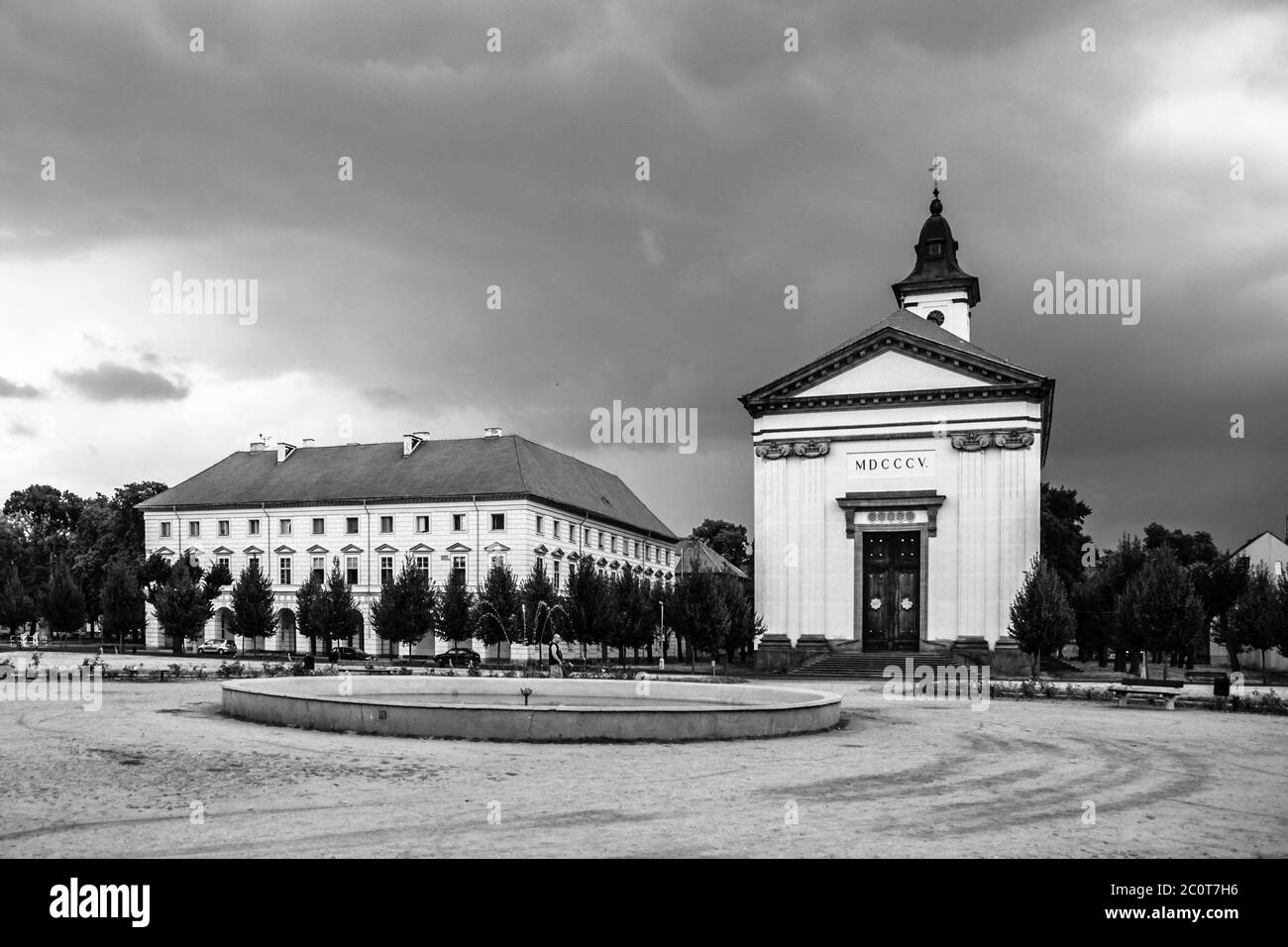 Czechoslovak Army Square with baroque church in Terezin fortress town, Czech Republic. Black and white image. Stock Photo